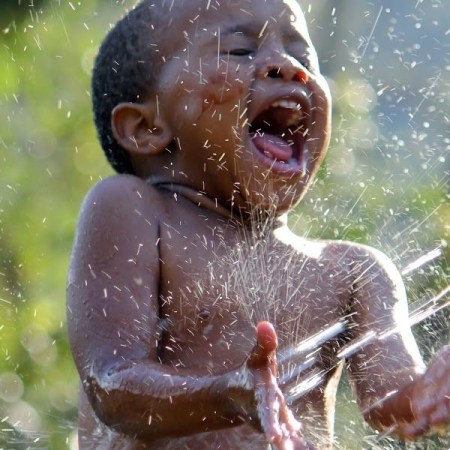 as laughter bubbles out of our world’s children like unspoken poems… 